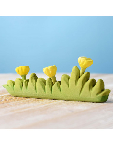 Groot gras met gele bloemen